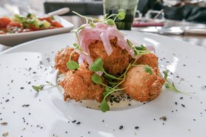 Smoked Salmon Beignets at NoMi Restaurant Chicago
